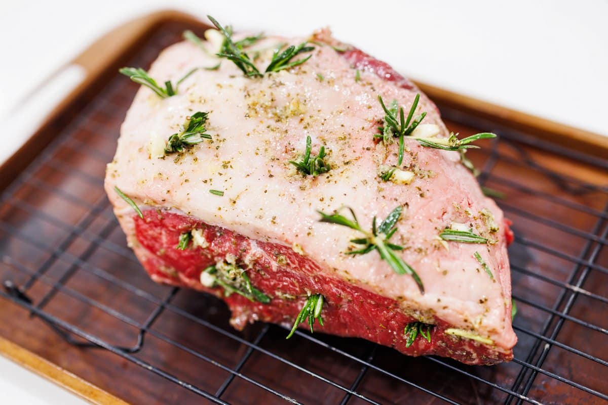 Prepared strip roast on a baking sheet.