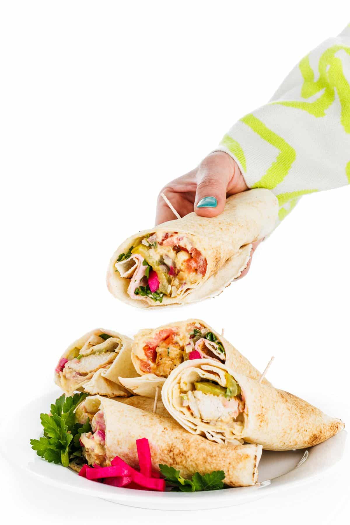 Grabbing a shish tawook pita with hummus.