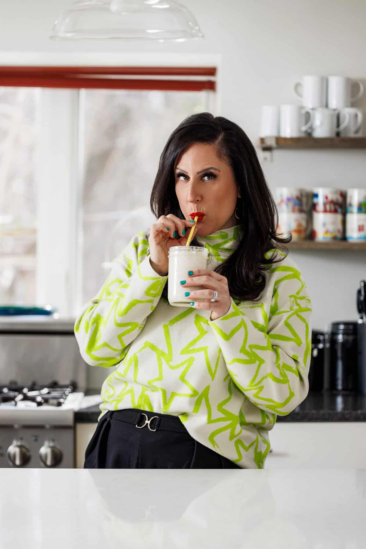 Liz drinking a banana licuado smoothie.