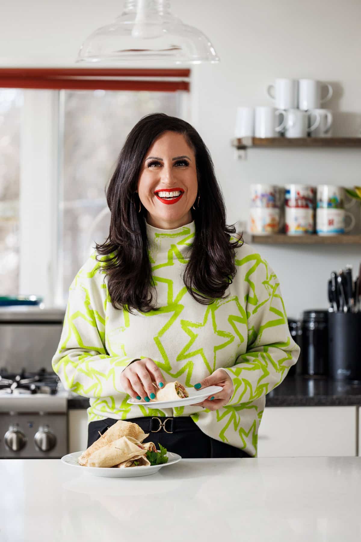 Liz eating shish tawook pita with hummus.