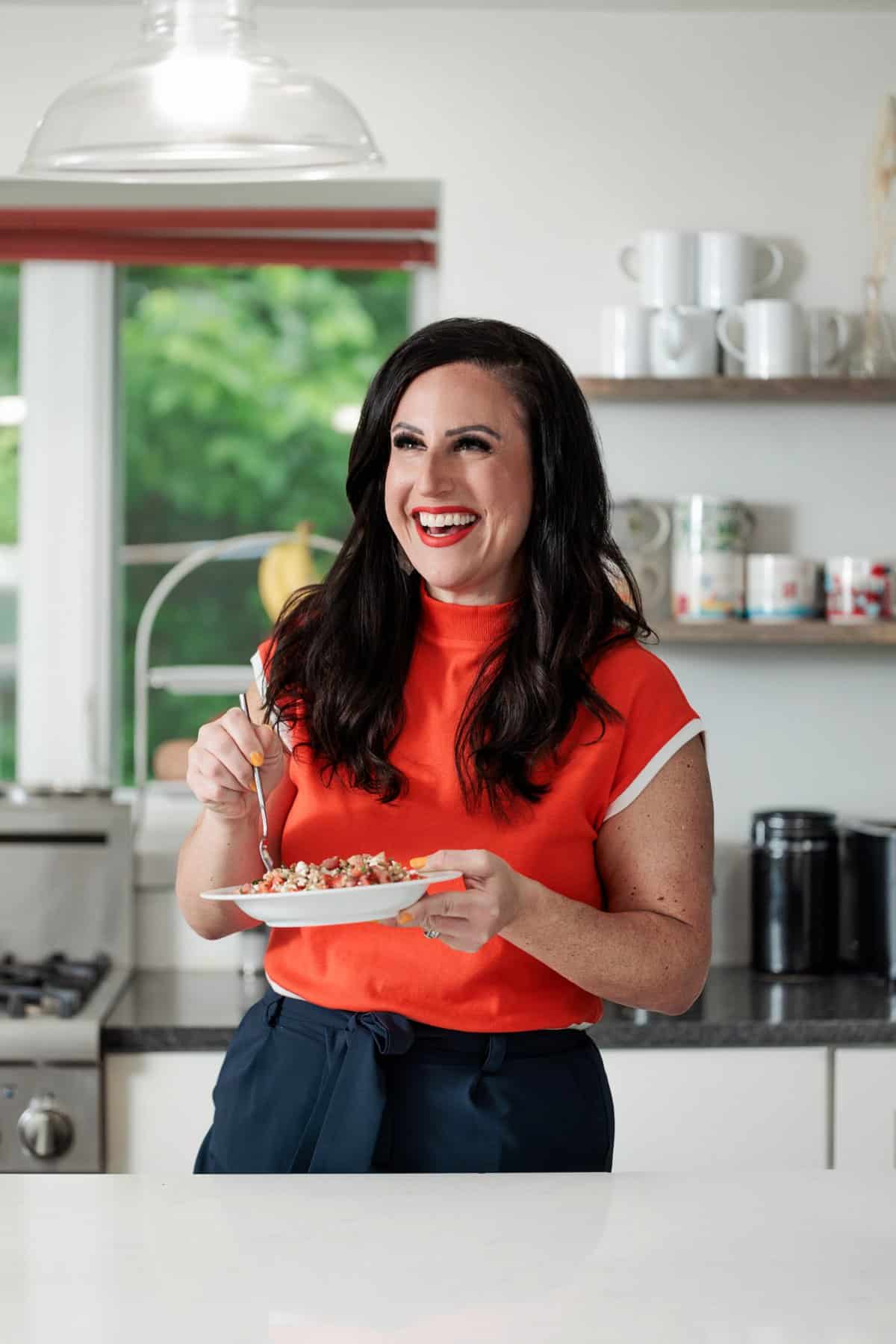 Liz eating Farro Greek Salad with Feta and Dill.