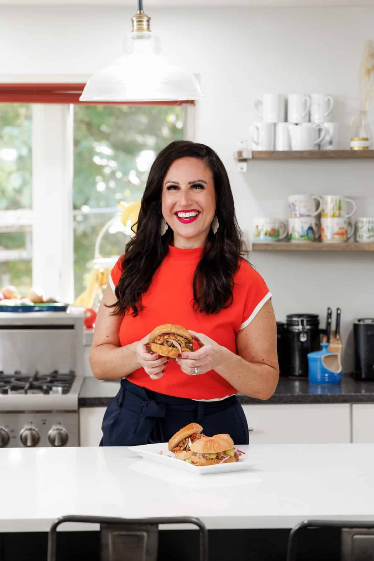 Liz eating pulled pork sliders with cabbage slaw.