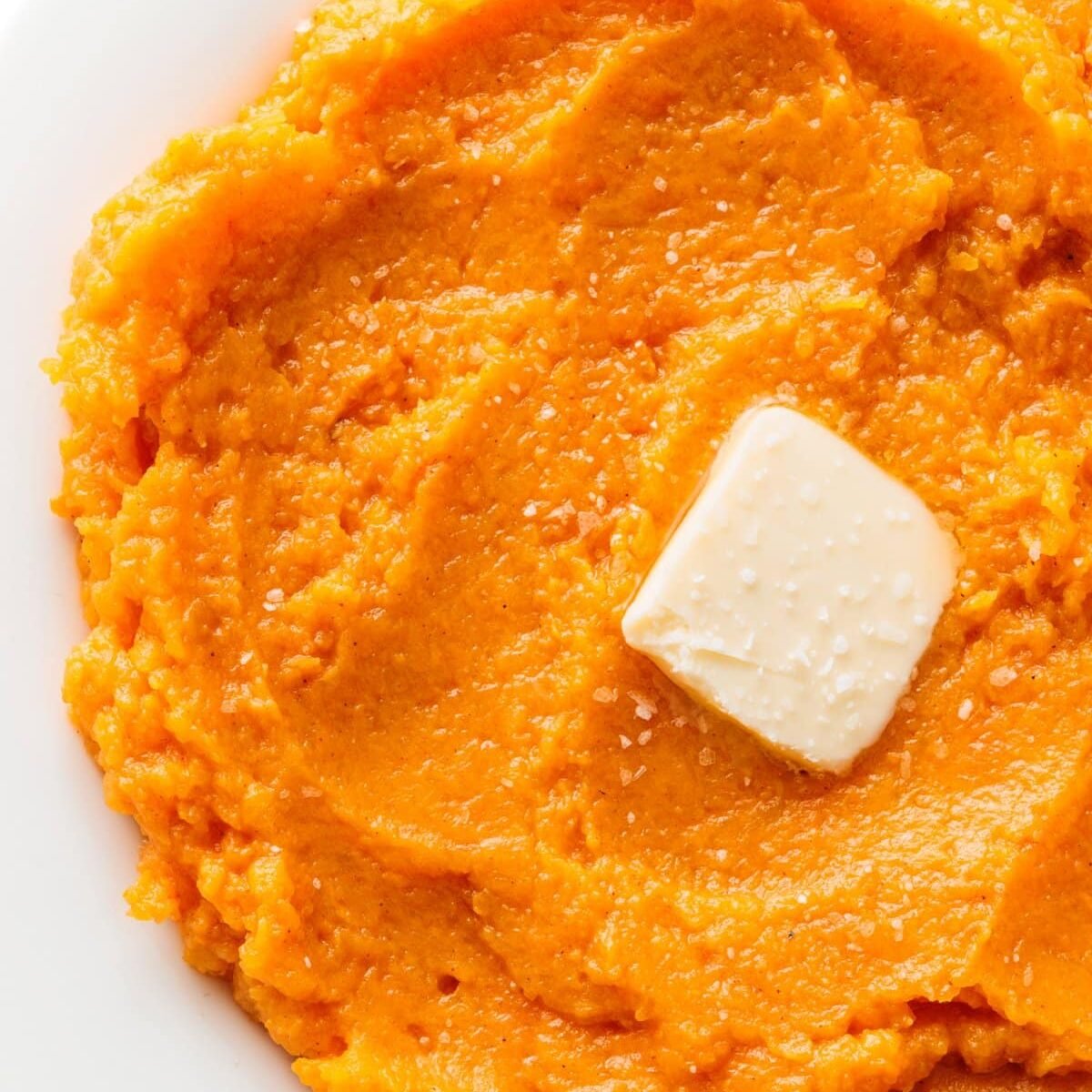 Mashed butternut squash and sweet potatoes with butter and salt, one of 20 healthier Thanksgiving side dishes.