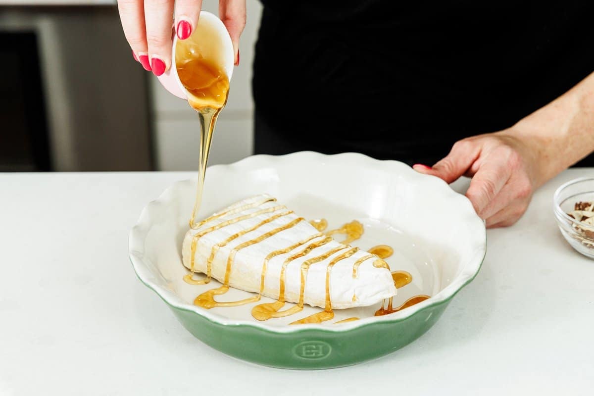 Drizzling brie with honey