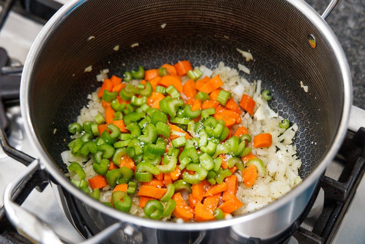 Diced celery and carrots in a large stock pot.