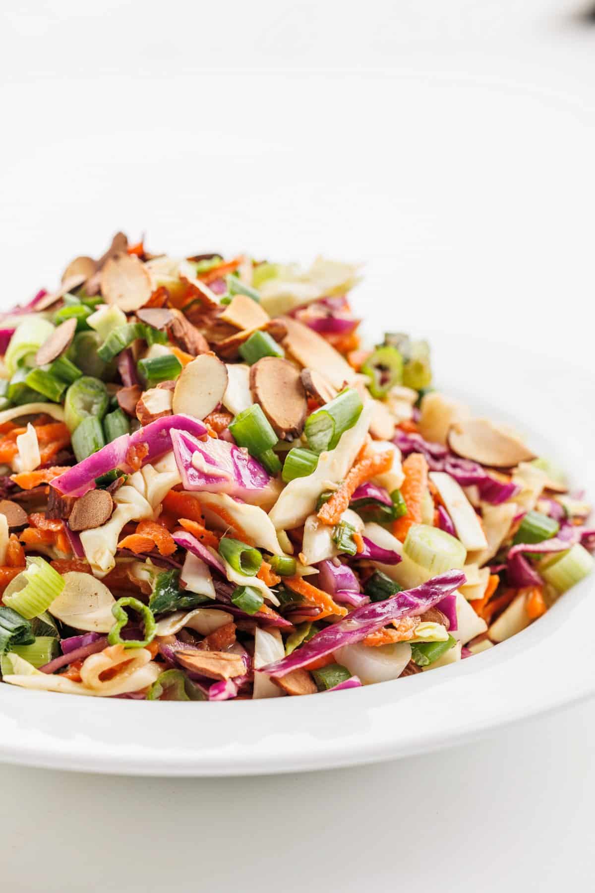 Spicy Asian coleslaw on a white plate.