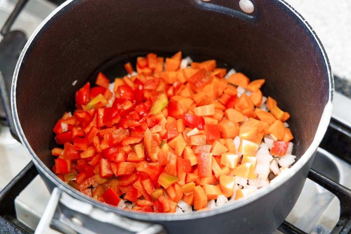 Red bell pepper added to pot.