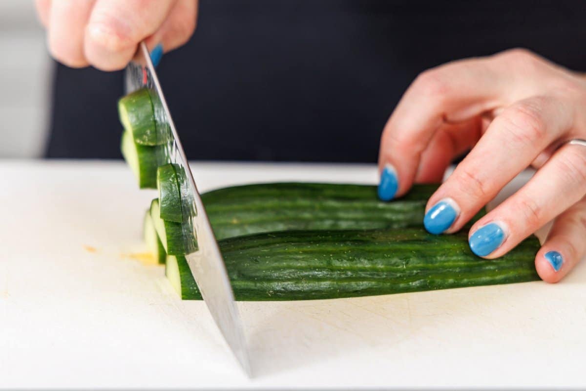 Liz slicing up an English cumber into this slices.