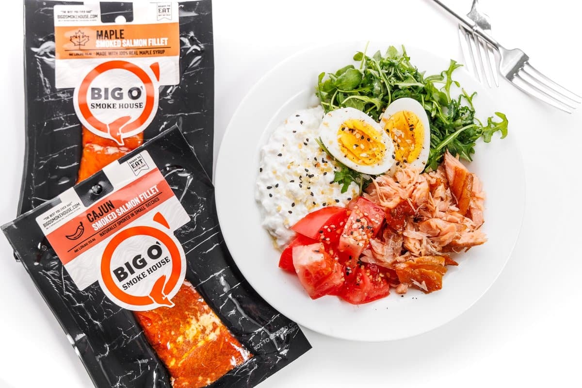 Big O' Smokehouse smoked salmon with a plate of salmon and arugula salad.