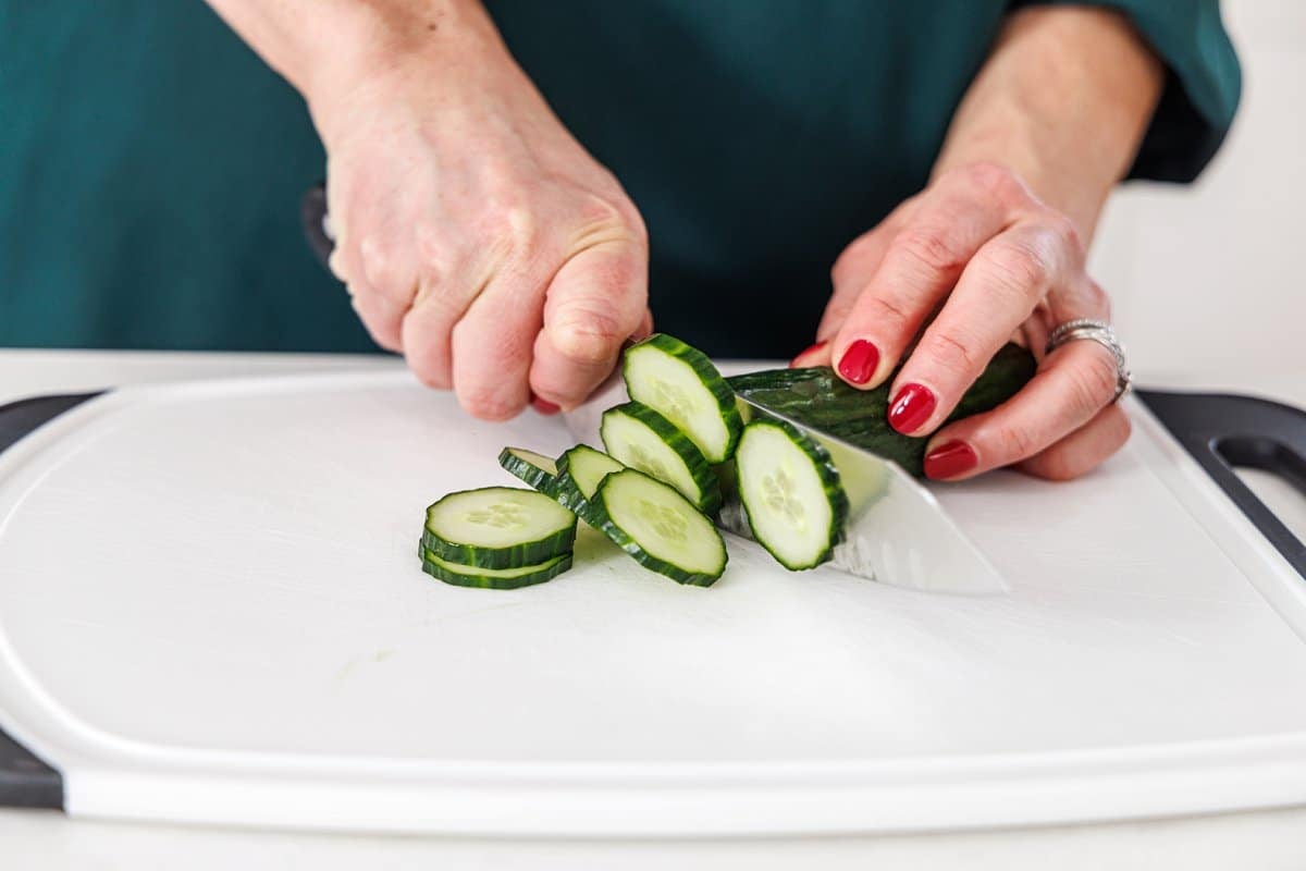 Liz slicing cucumber.