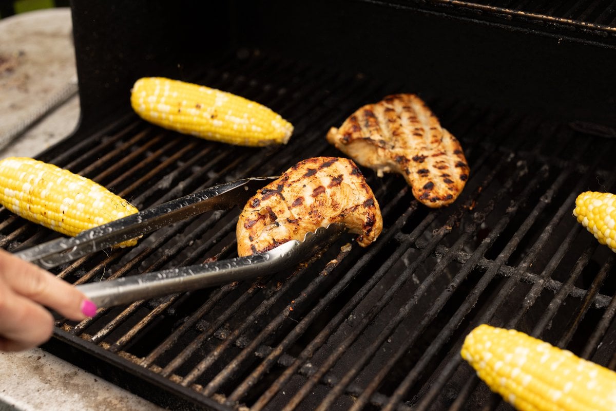 Grilling teriyaki turkey tenderloins on grill.