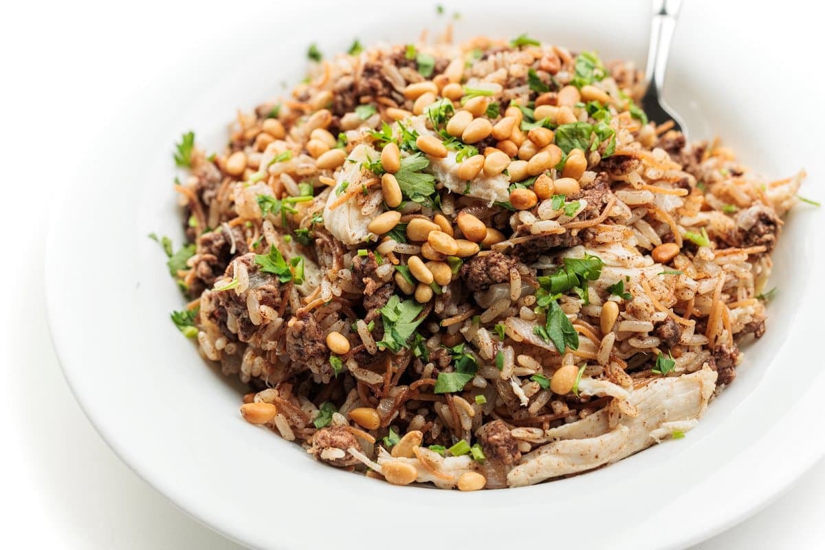 Plate full of Lebanese hushwee rice with chicken.