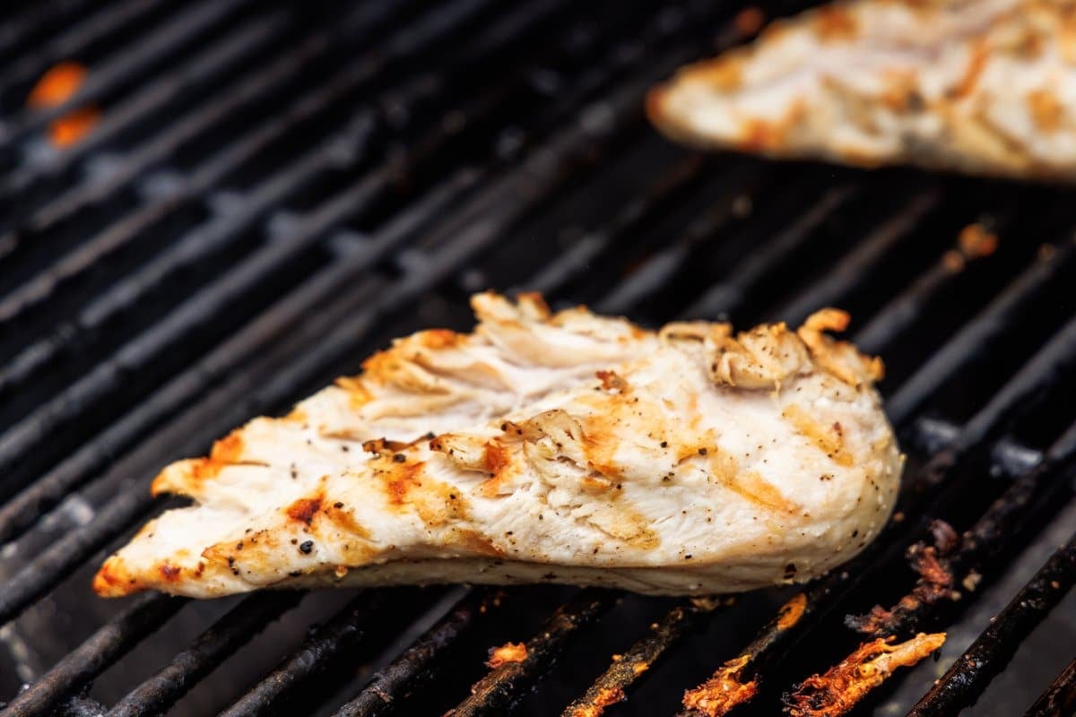 Chicken breast cooking on the grill.