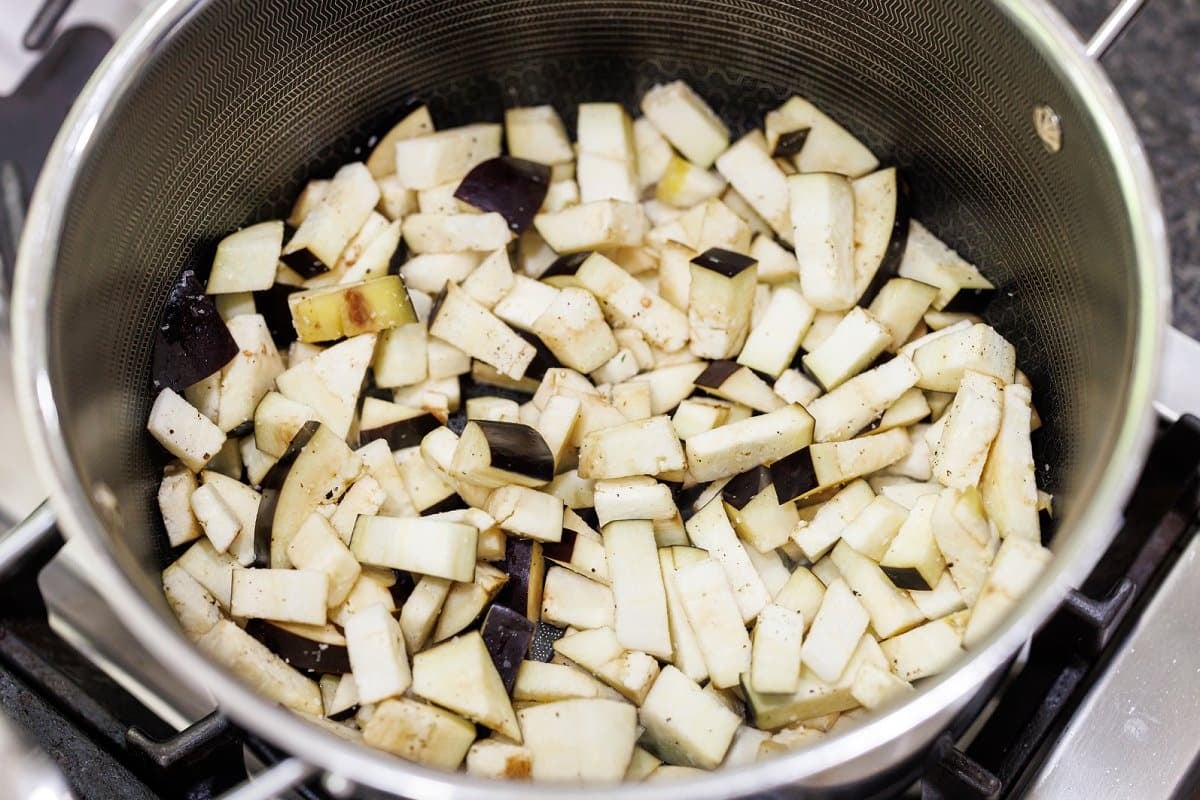 Chopped eggplant in a saucepan.