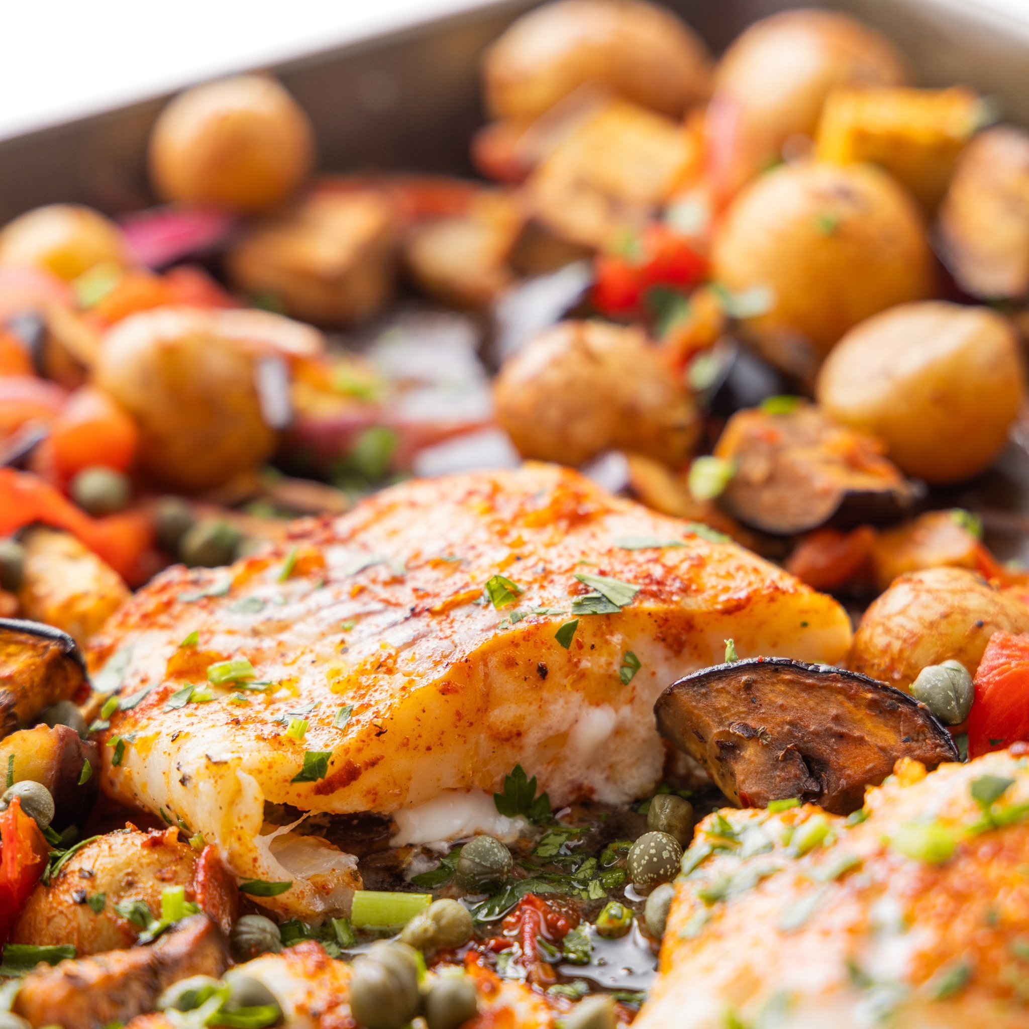 Mediterranean Baked White Fish with Potatoes, Eggplant, and Tomatoes