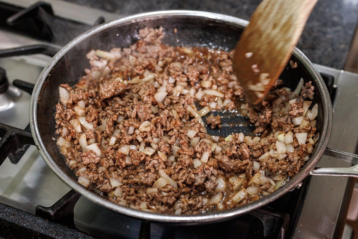Cooking ground lamb and onion.