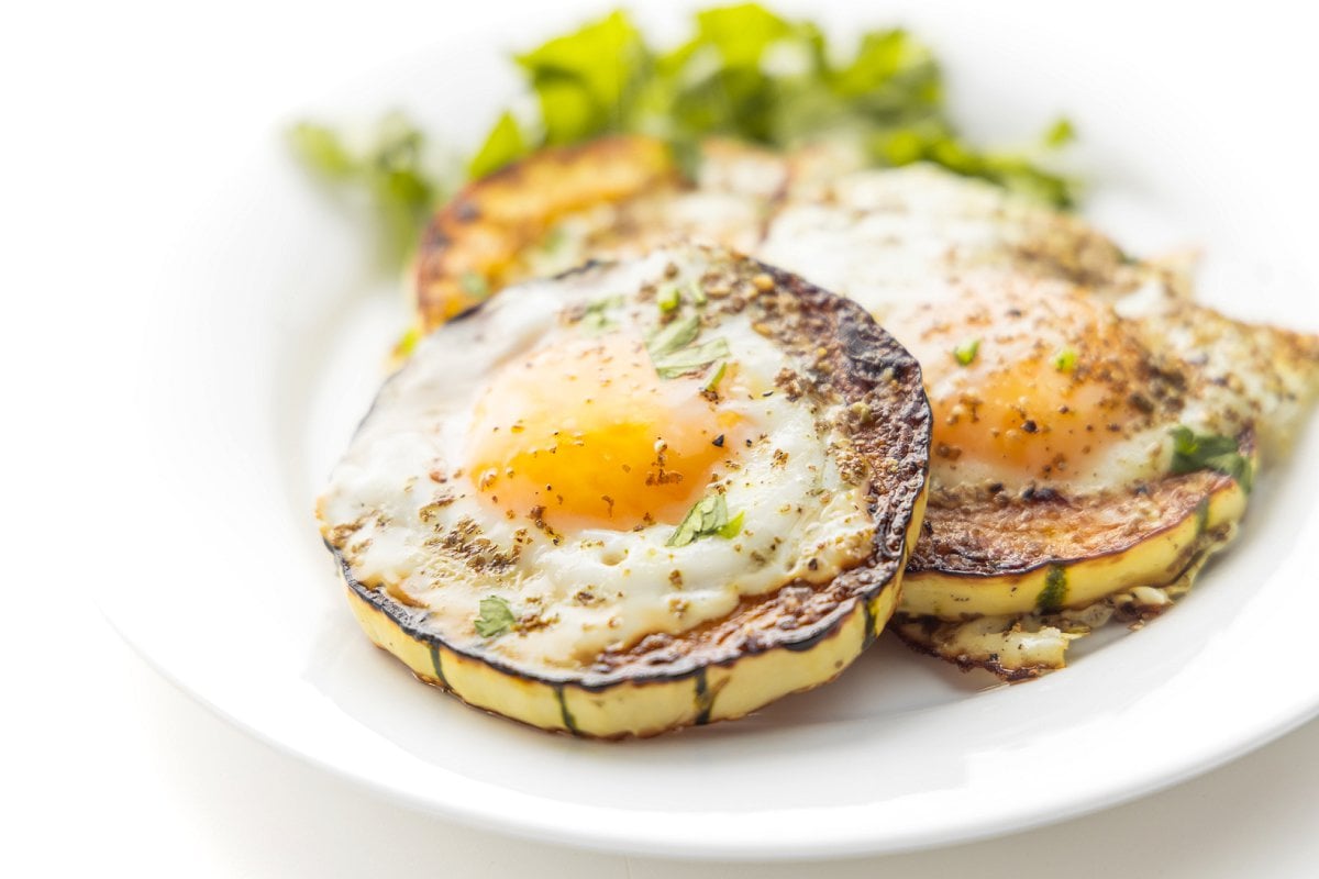 Delicata squash egg cups, a healthy way to eat eggs.
