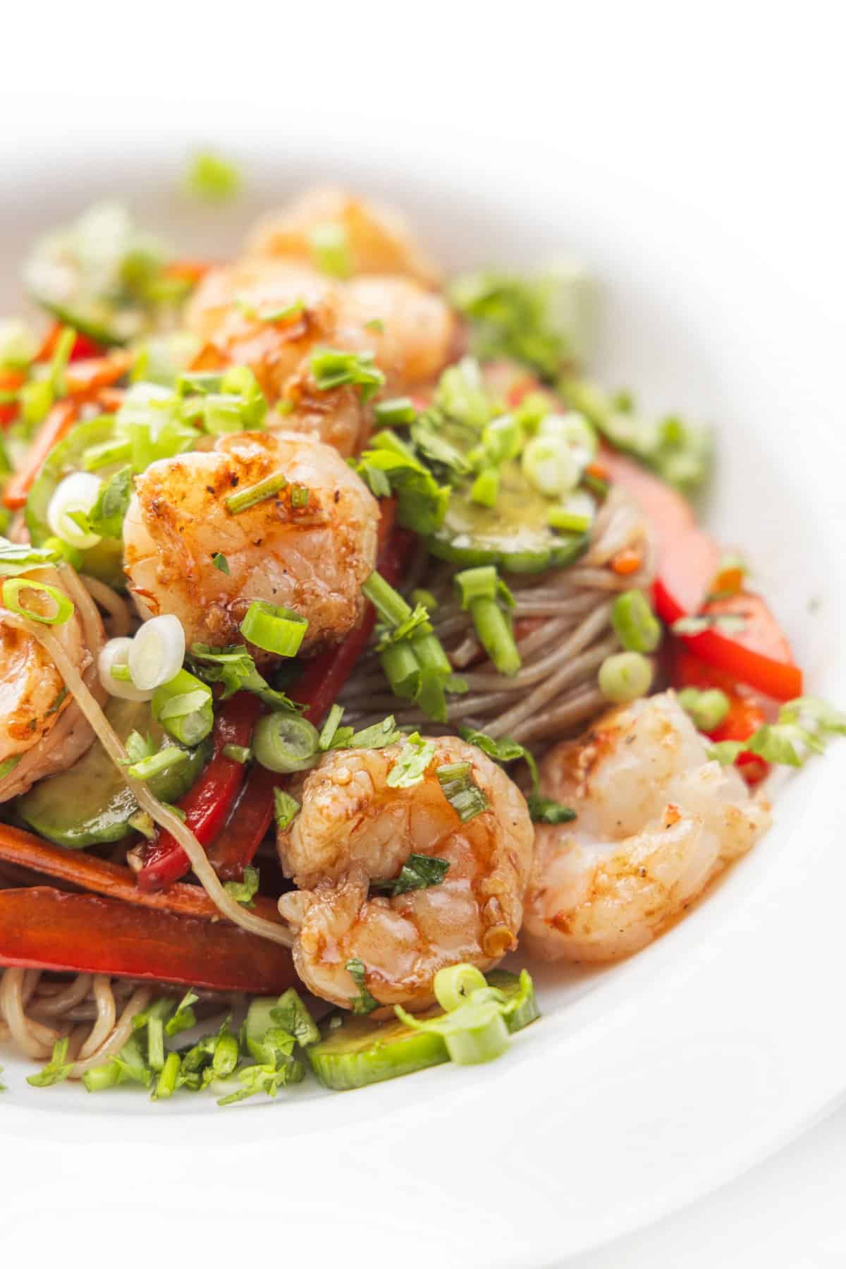 Plate full of Thai shrimp salad with rice noodles.