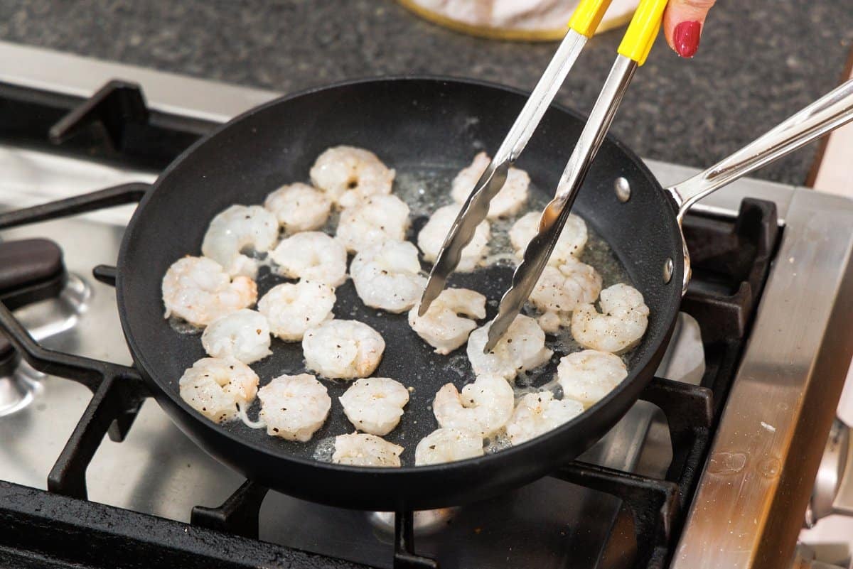 Cooking shrimp in saute pan.
