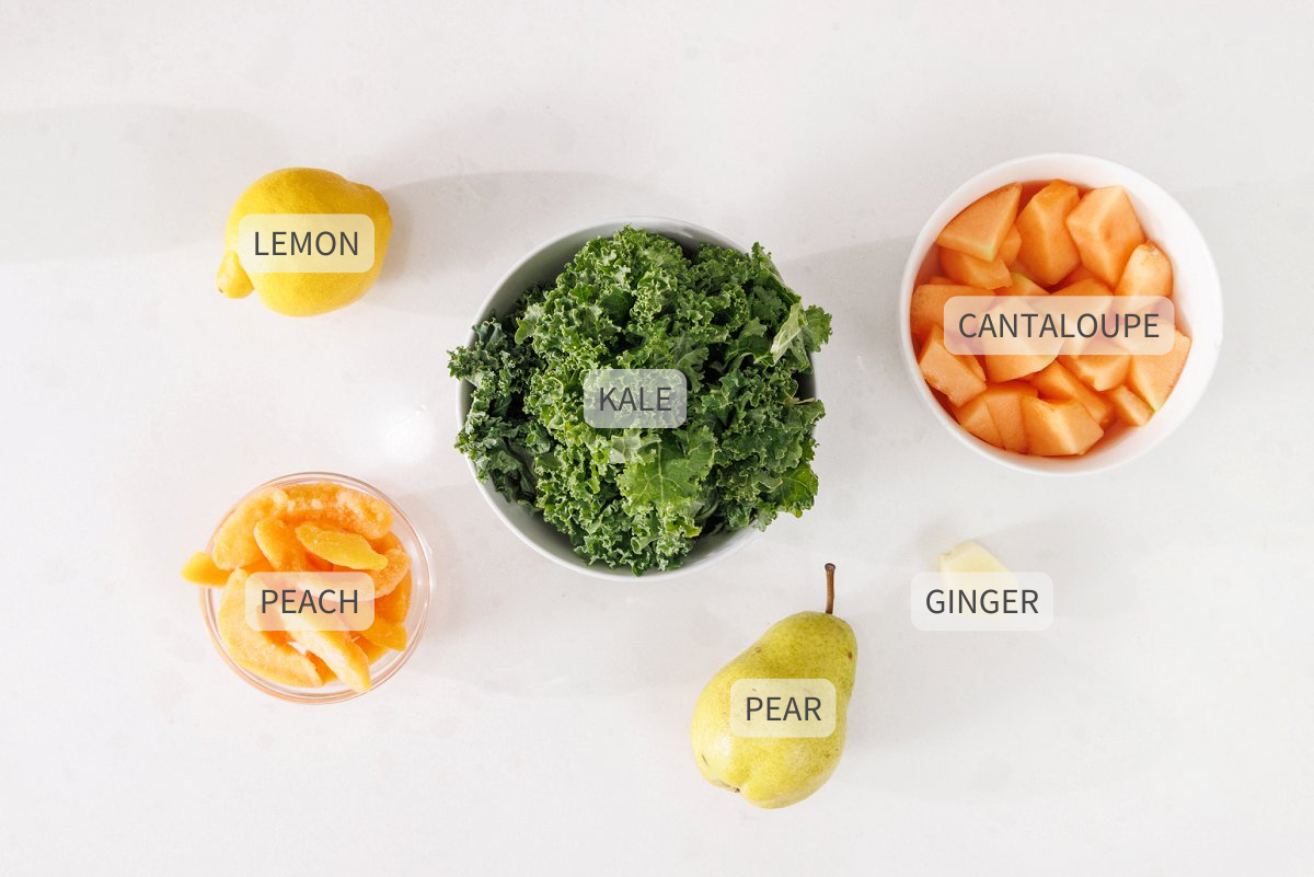 Labeled ingredients for kale, pear, and peach green juice.
